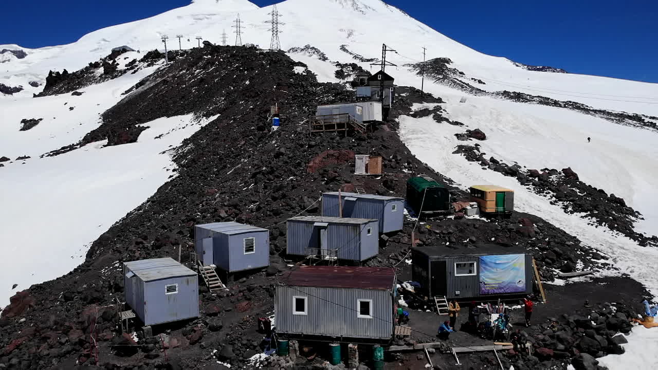 Mountain landscape with buildings and snow