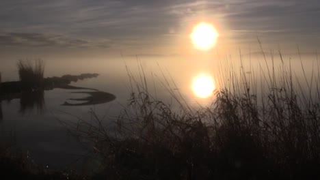 misty sunset on loch skene