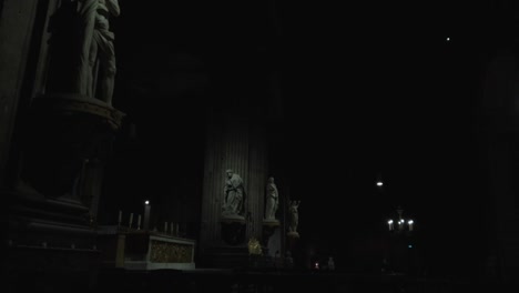 lighten saints statues in a dark old church