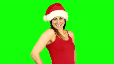 Pretty-girl-in-santa-hat-sending-an-air-kiss-to-camera