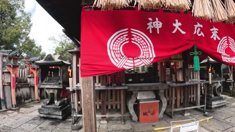 red flag waves above a serene japanese shrine