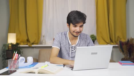 Male-student-Chatting-with-Beloved-on-Laptop.