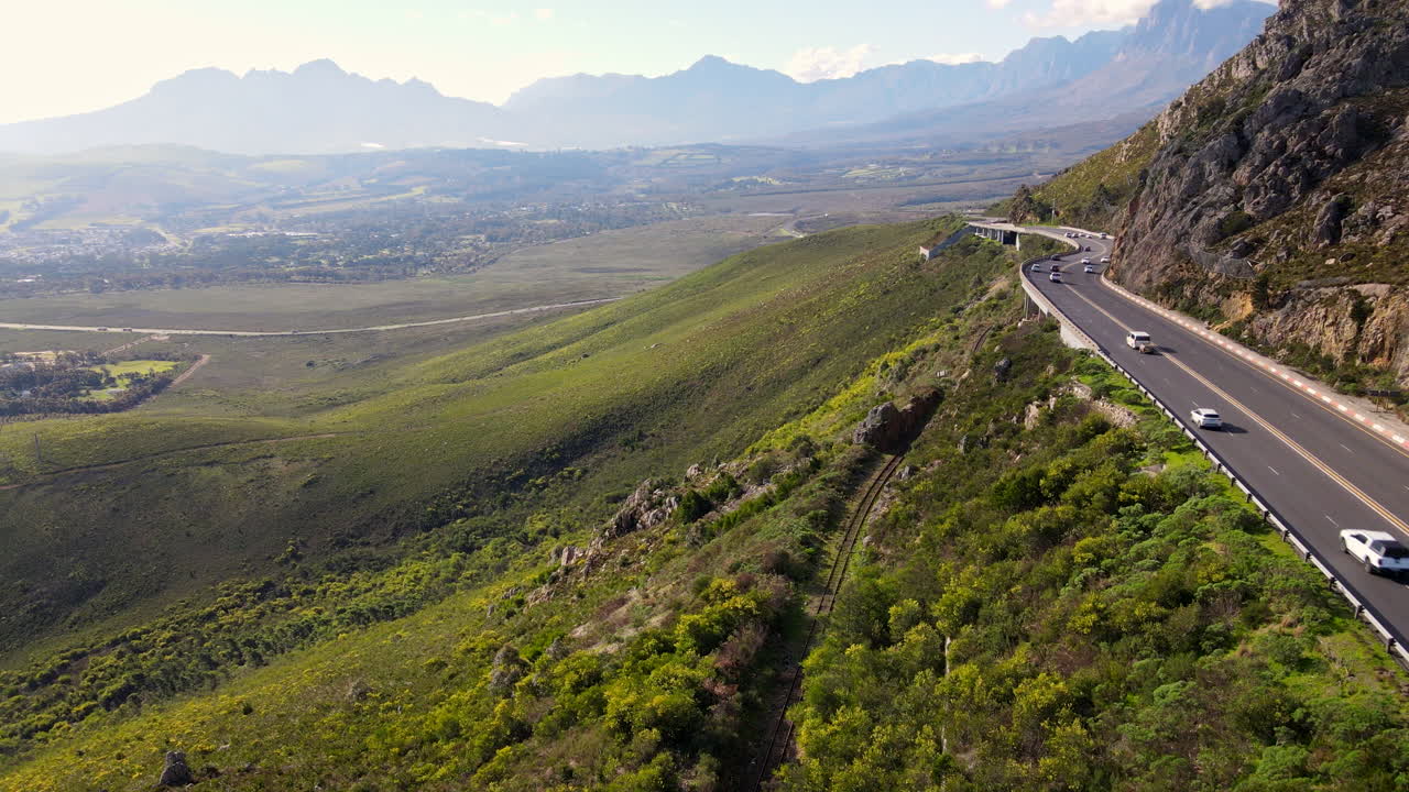 Aerial view over railway and traffic flowing on Sir Lowry's Pass, Western Cape
