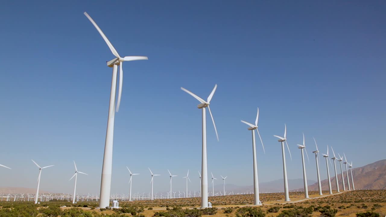 A cinematic view of renewable energy wind turbines on the mountain