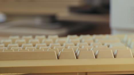man working and gaming on retro computer pc, it engineer with vintage computer at home, using old fashion technology, close up of retro setup.