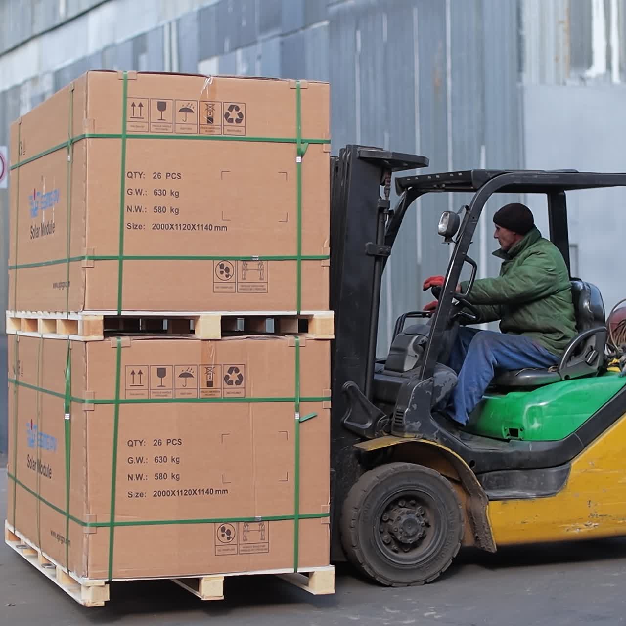 Industrial professional forklift transportation. Man working with factory loader