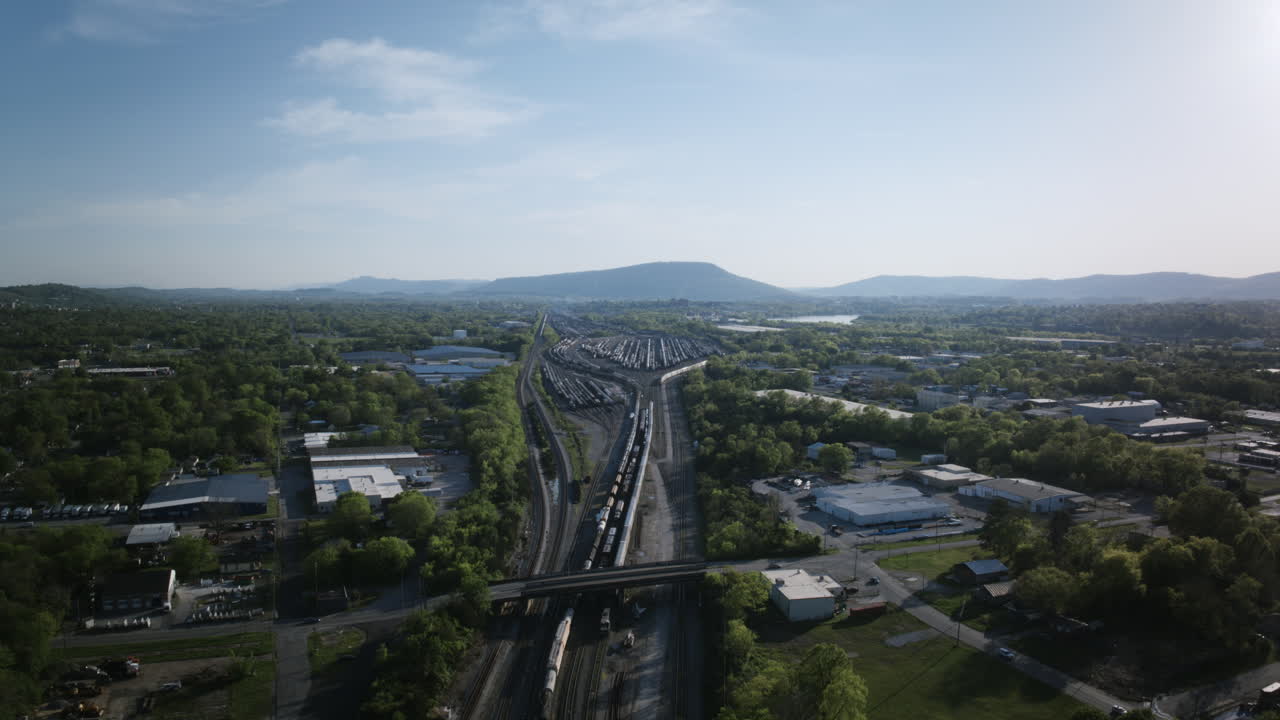 Aerial timelapse of a trainyard in Chattanooga, TN with lookout mountain in the background.