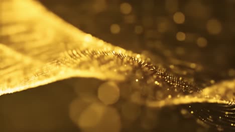 delicate golden waves undulate smoothly, creating an enchanting display of light and movement. the serene flow captivates with its shimmering beauty and intricate detail.