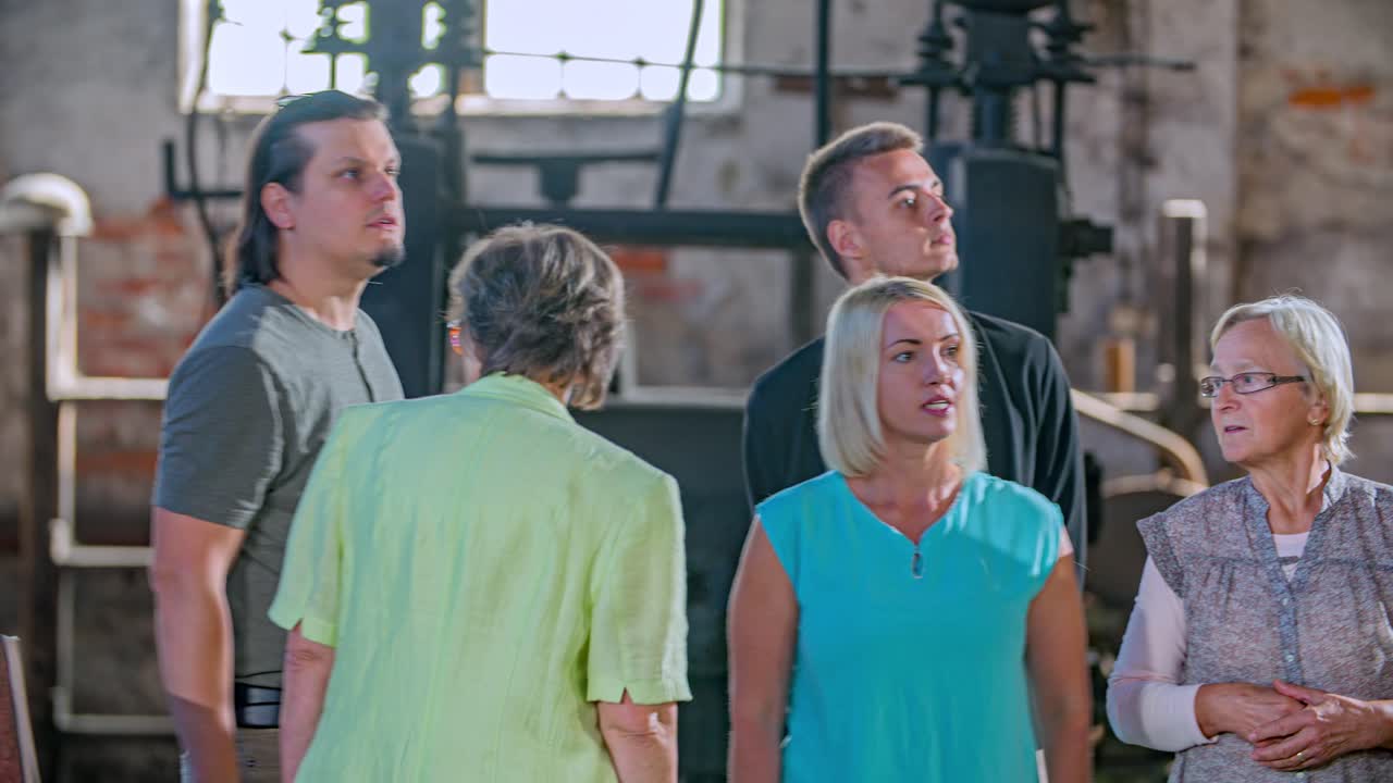 Group of people visiting a historical factory