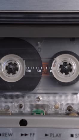 close-up of a vintage cassette tape in a tape deck