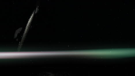 tennis racket being highlighted floating in void as 3d render, with neon beam and gloved hand