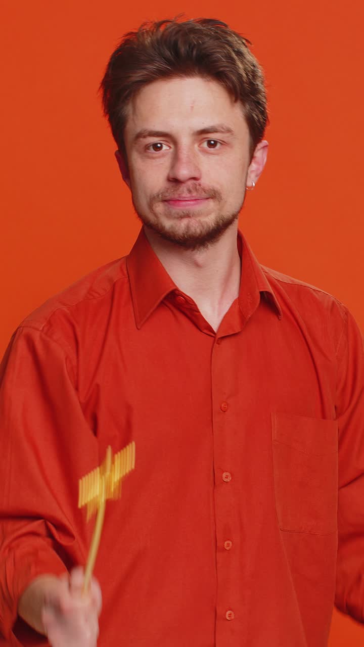 Magician wizard young man gesturing with magic wand making wish come true casting magician spell