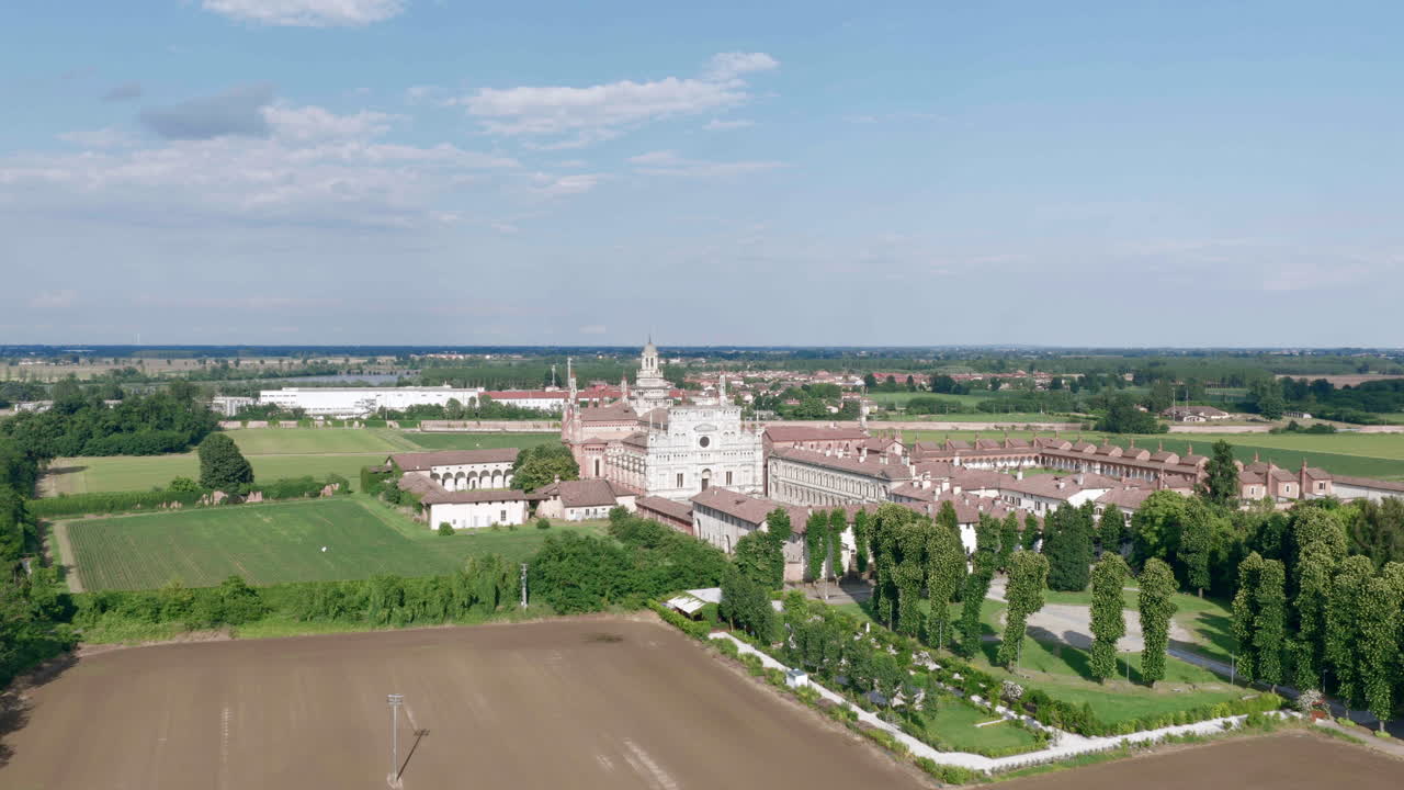 Drone view of Certosa di Pavia Gra-Car (Gratiarum Carthusia, Monastery of Santa Maria delle Grazie - Sec. XIV), Pavia, Italy