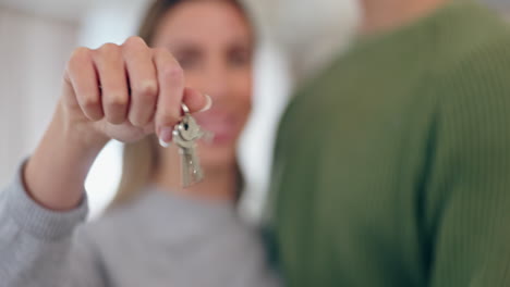 Hands,-couple-and-keys-in-new-home-for-moving