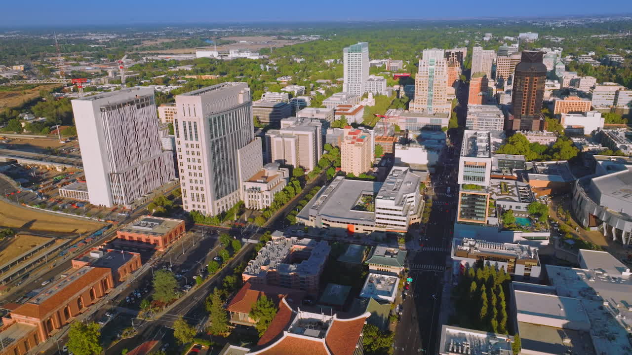 Architecture of modern Sacramento city, California, USA. Sunny scenic panorama of the State capital from aerial view.