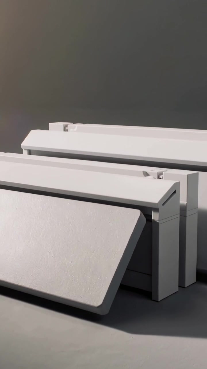 Vertical video: Camera panning three white modules tilting hinged panels at studio