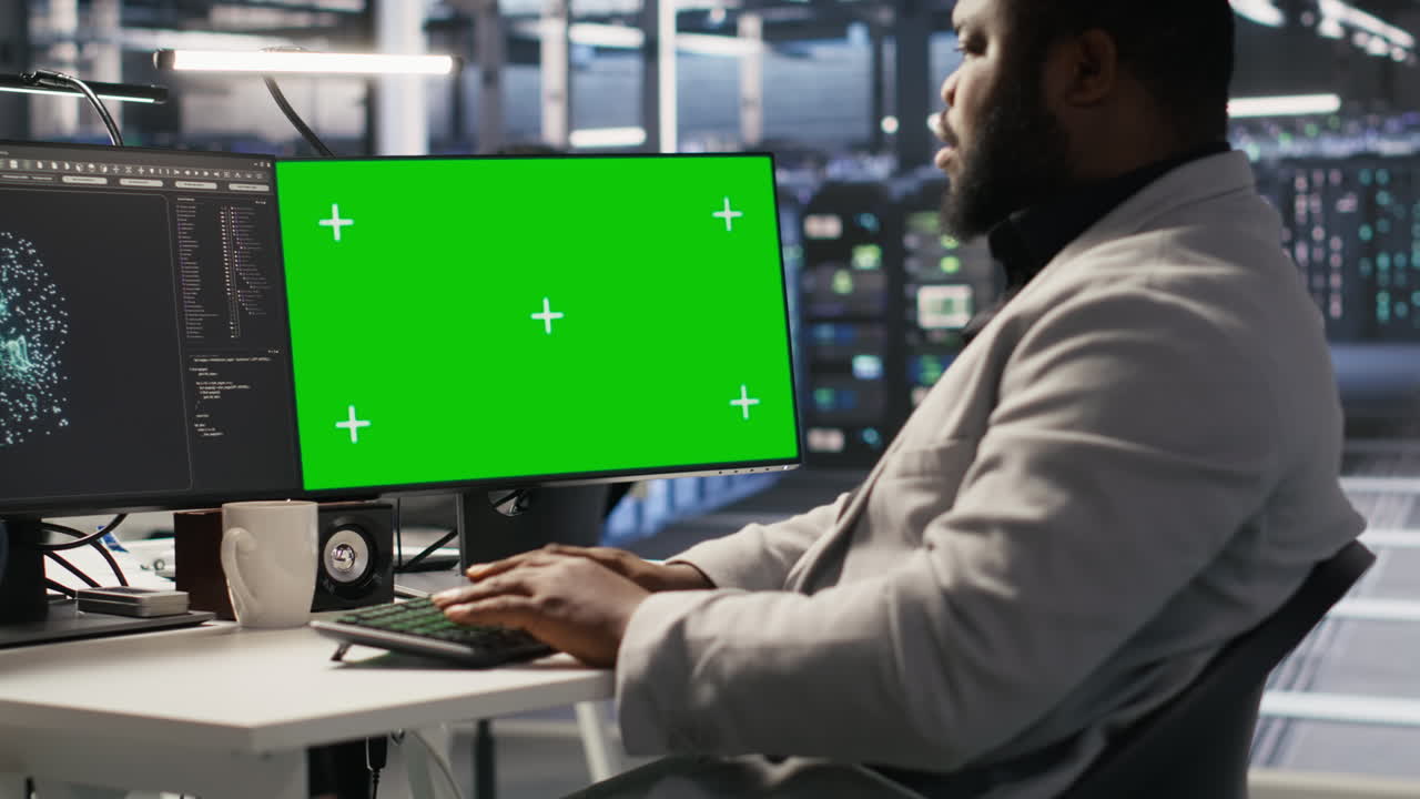 Data center programmer coding on green screen pc, monitoring ai systems ...