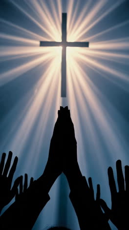 worship and faith: hands reaching towards the divine cross