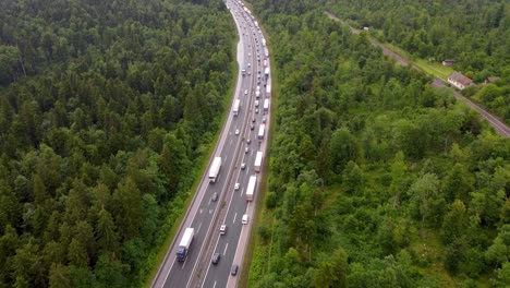 Emergency-lane-forming-on-a-2-lane-highway-due-to-traffic-accident-with-heavy-traffic-making-congestion-in-a-small-European-country