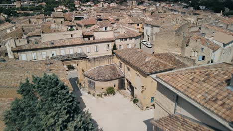 lauris france weathered grey brown rooftops in the countryside, aerial dolly