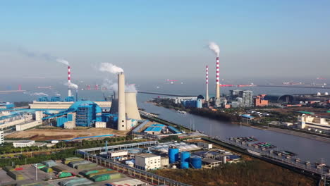 Aerial-view-of-a-coal-fired-steam-power-plant-production-of-chemical-products-installation-and-port-entrance-for-large-ships