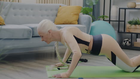 senior woman doing exercises at home