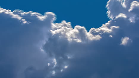 Time-lapse-shot-of-soft-formation-of-clouds-and-cloudscape-against-blue-sky-and-sun---5K-Prores-Footage