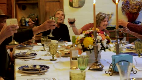 a large group of seniors toast each other at a party