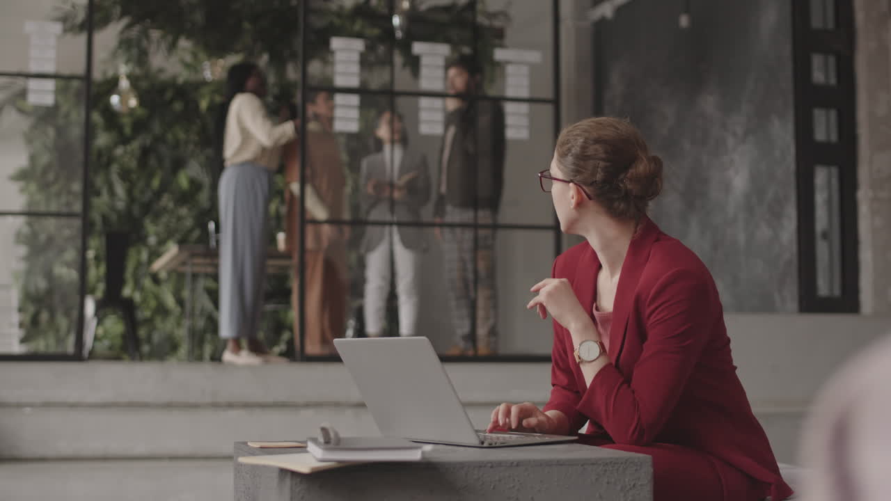 Caucasian Woman Using Computer in Office