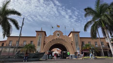 timelapse of the historical colonial market of santa cruz de tenerife, la recova, with a changing sky with few clouds and people coming and going. 4k