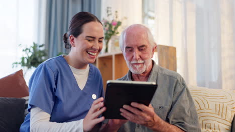 caregiver assisting a senior with a tablet