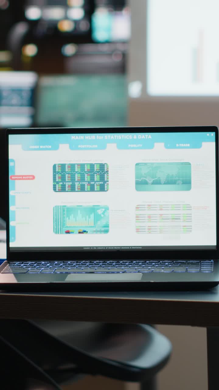 Vertical Video Laptop displaying digital data in a clean modern workspace in the evening