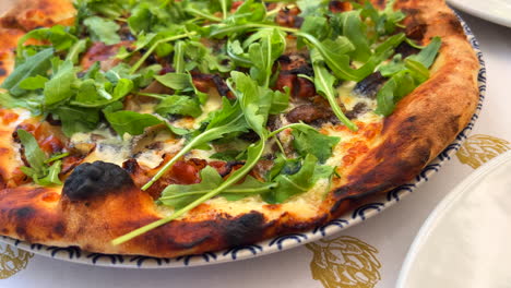 traditional italian guanciale and truffle pizza with rocket salad and truffle oil, perfect crust, real authentic neapolitan pizza, tasty food, 4k shot