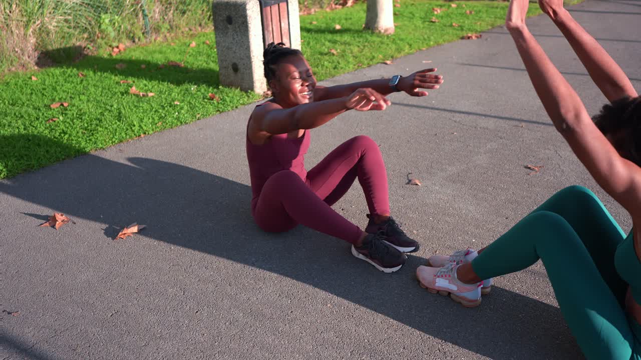Women exercising outdoors in a park