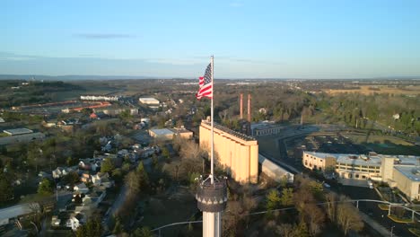 Aerial-drone-view-of-American-flag-blowing-in-wind