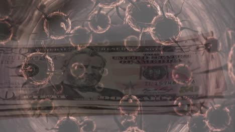 animation of macro covid-19 cells floating over a person putting american dollar bills on a table.