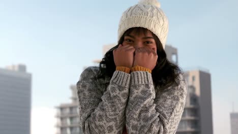 woman shivering on a winters day