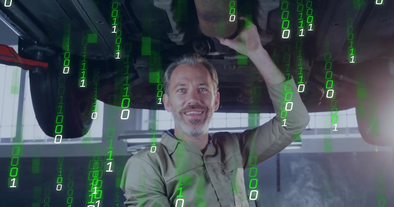 Male auto mechanic aligning part after vehicle lift, green binary overlay growing to partly obscure