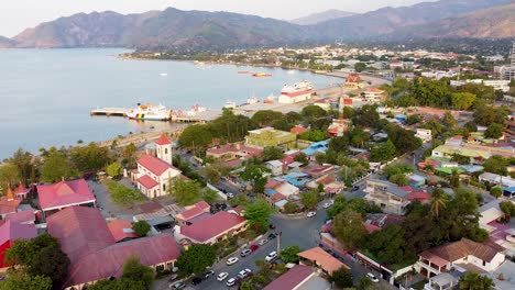 aerial drone view of the capital city of dili, timor-leste in southeast asia with residential houses surrounded by streets and trees