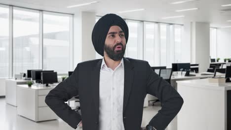 worried sikh indian businessman thinking