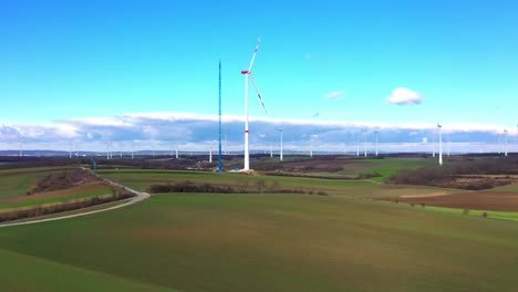 Aerial-View-Of-Large-Wind-Turbine-Under-Construction---drone-shot