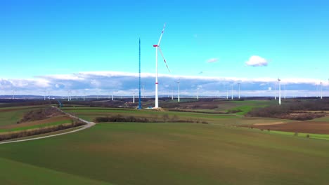 aerial view of large wind turbine under construction - drone shot