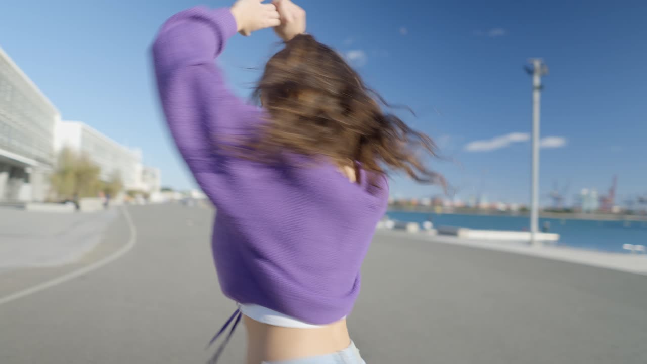Young Woman Dancing in a City Port