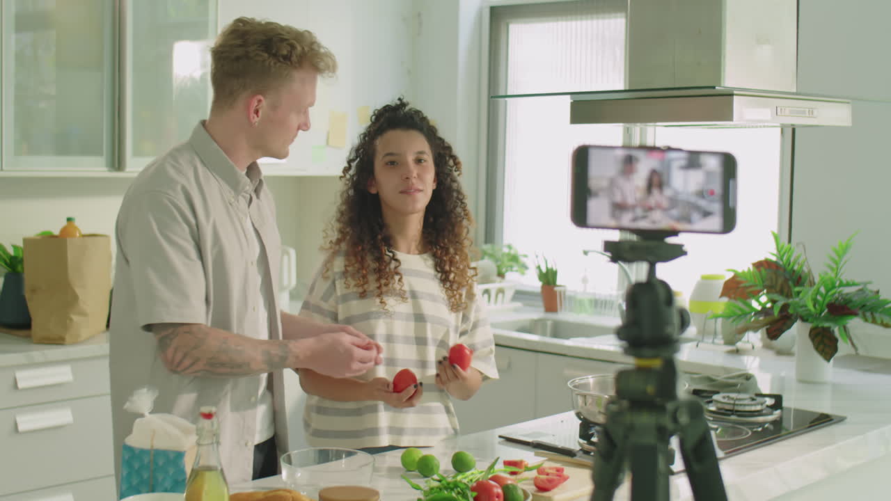 Couple Filming Video Recipe for Cooking Vlog in Kitchen