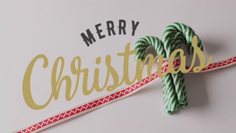 animación de saludos de navidad texto sobre las decoraciones de los caramelos de navidad.