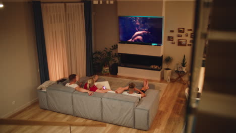 friends watching tv at home