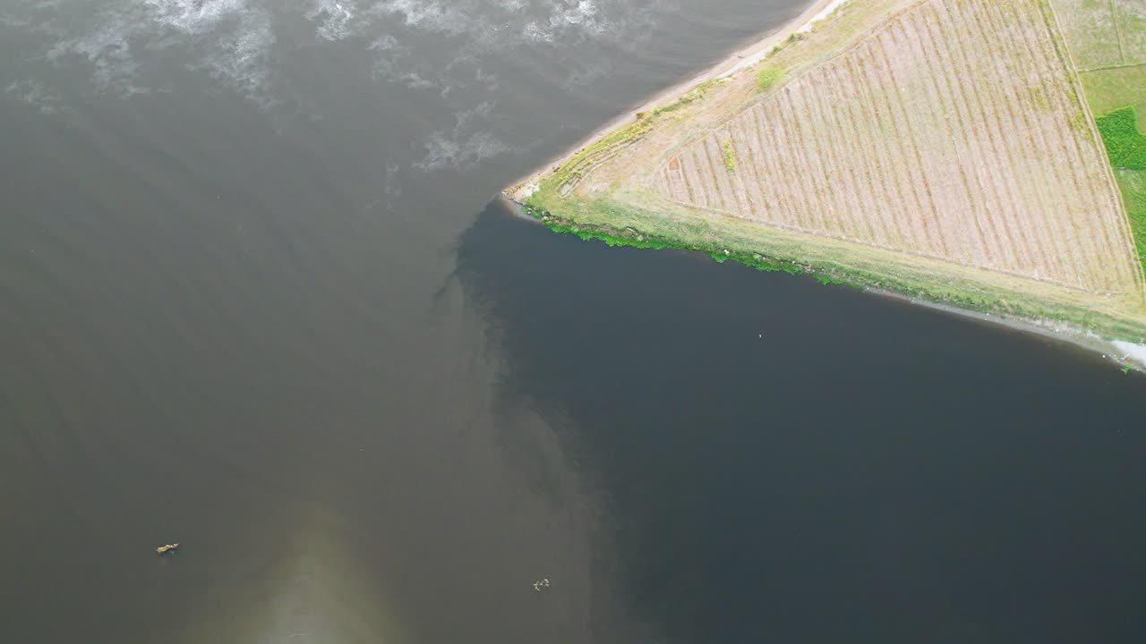 Triangular farmland bordering Sutlej River near India–Pakistan frontier. Punjab