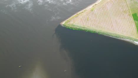 triangular farmland bordering sutlej river near india–pakistan frontier. punjab