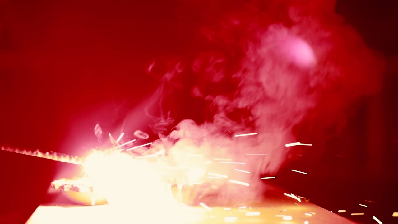 Fire and Light: A Contrast of Sparks and Diya Lamps