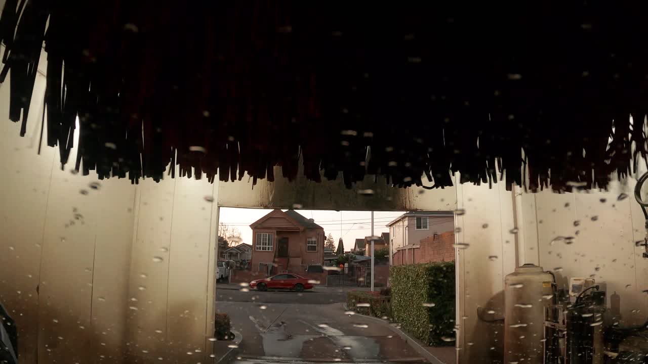 Sitting inside of a running automatic car wash.